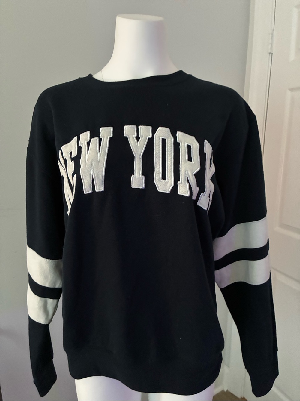 Black 'New York' Pullover Sweatshirt with White Sleeve Stripes